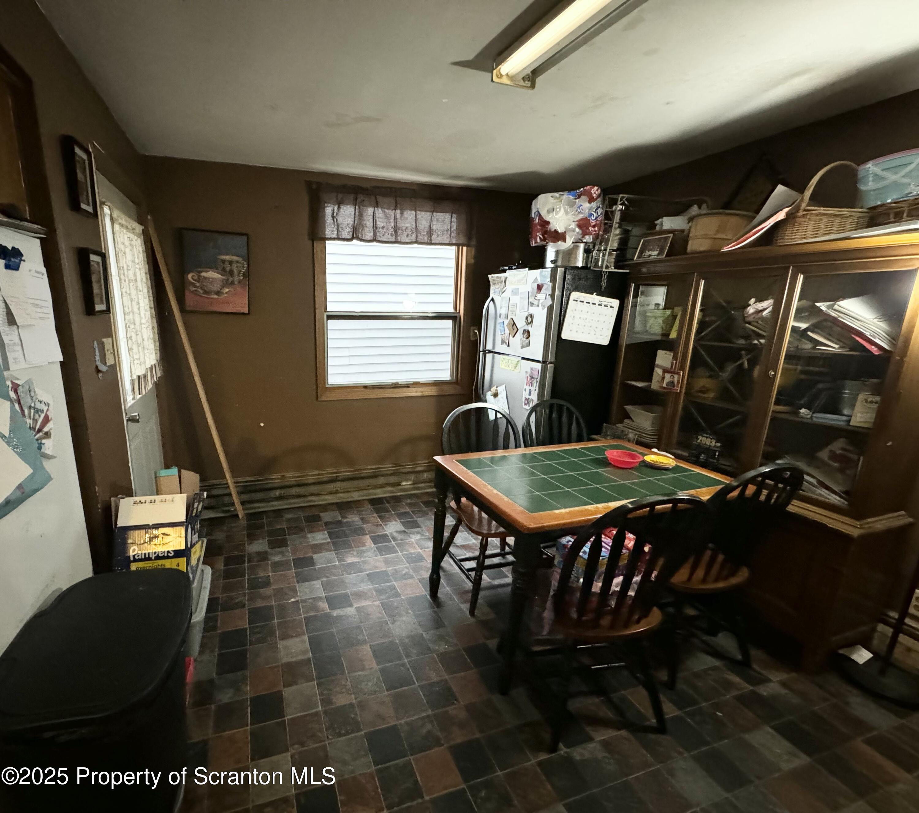 520 Charles Street Luzerne, PA 18709 - Photo 12 of 31 a living room with furniture a rug a fireplace and a window