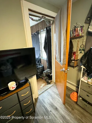 a bedroom with furniture and a chandelier