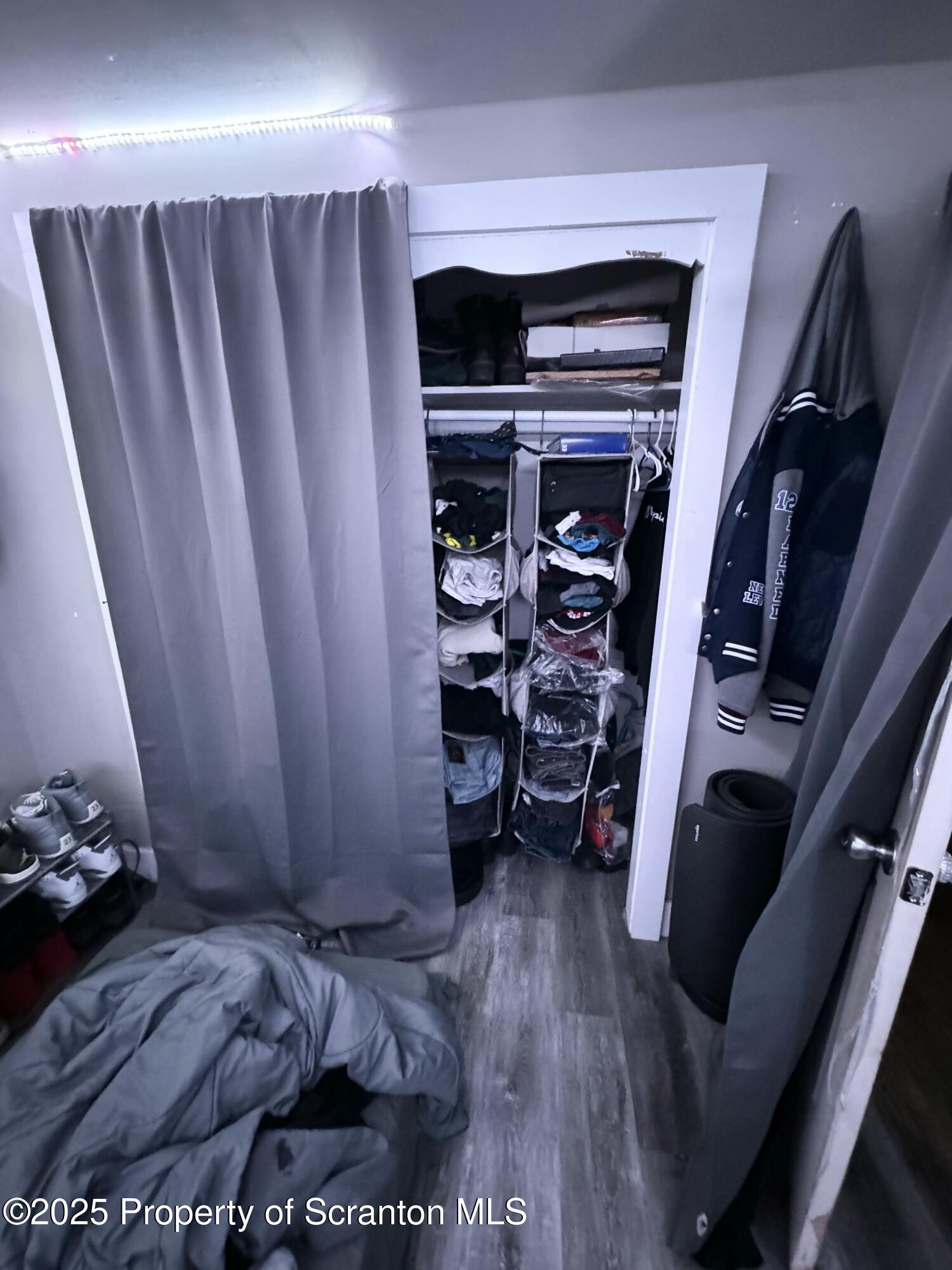 520 Charles Street Luzerne, PA 18709 - Photo 24 of 31 a view of walk in closet with clothes and shoes