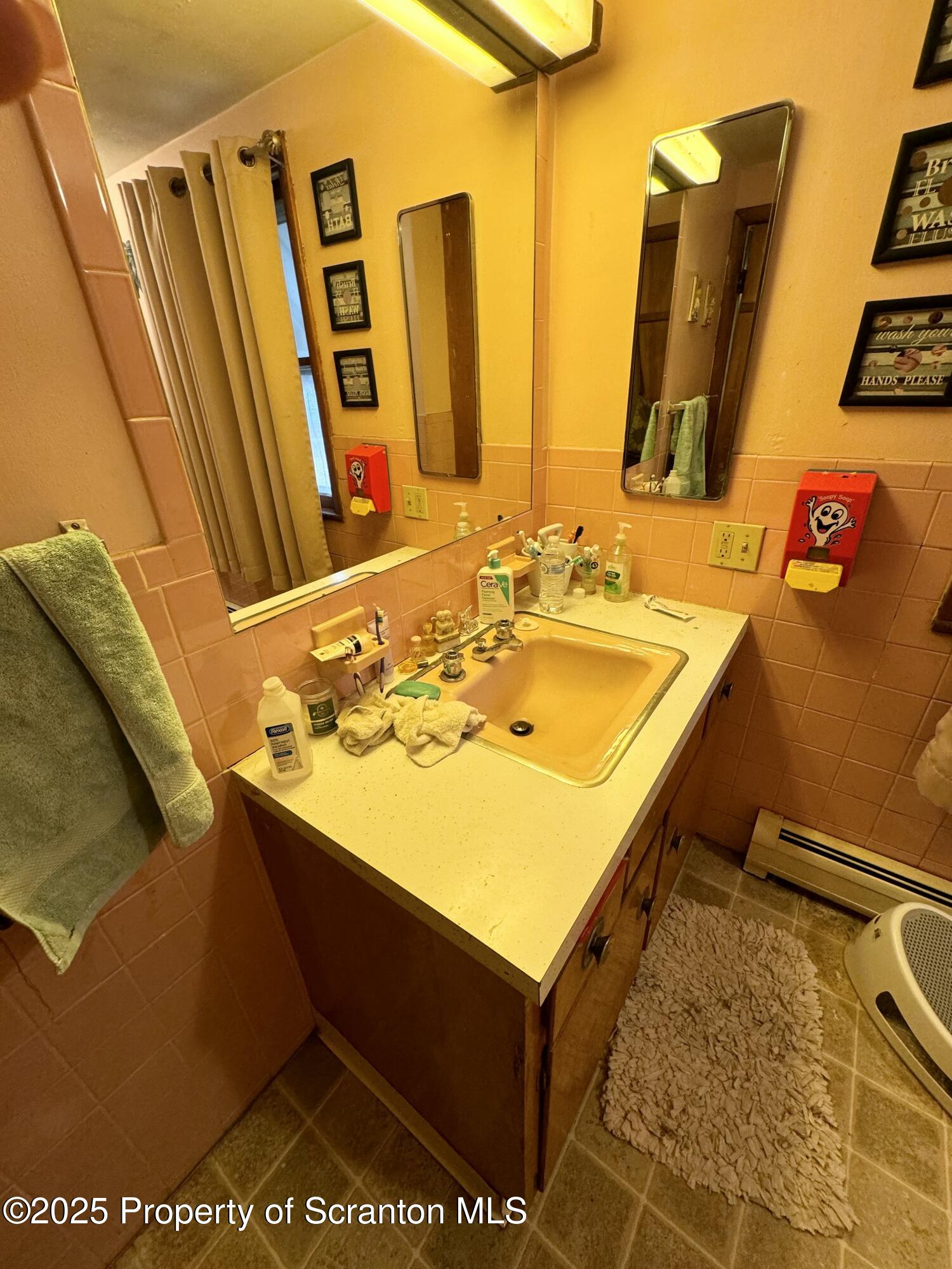 520 Charles Street Luzerne, PA 18709 - Photo 27 of 31 a bathroom with a sink and a mirror