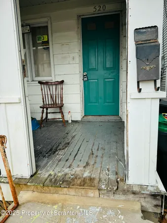 a view of a livingroom with furniture and a door