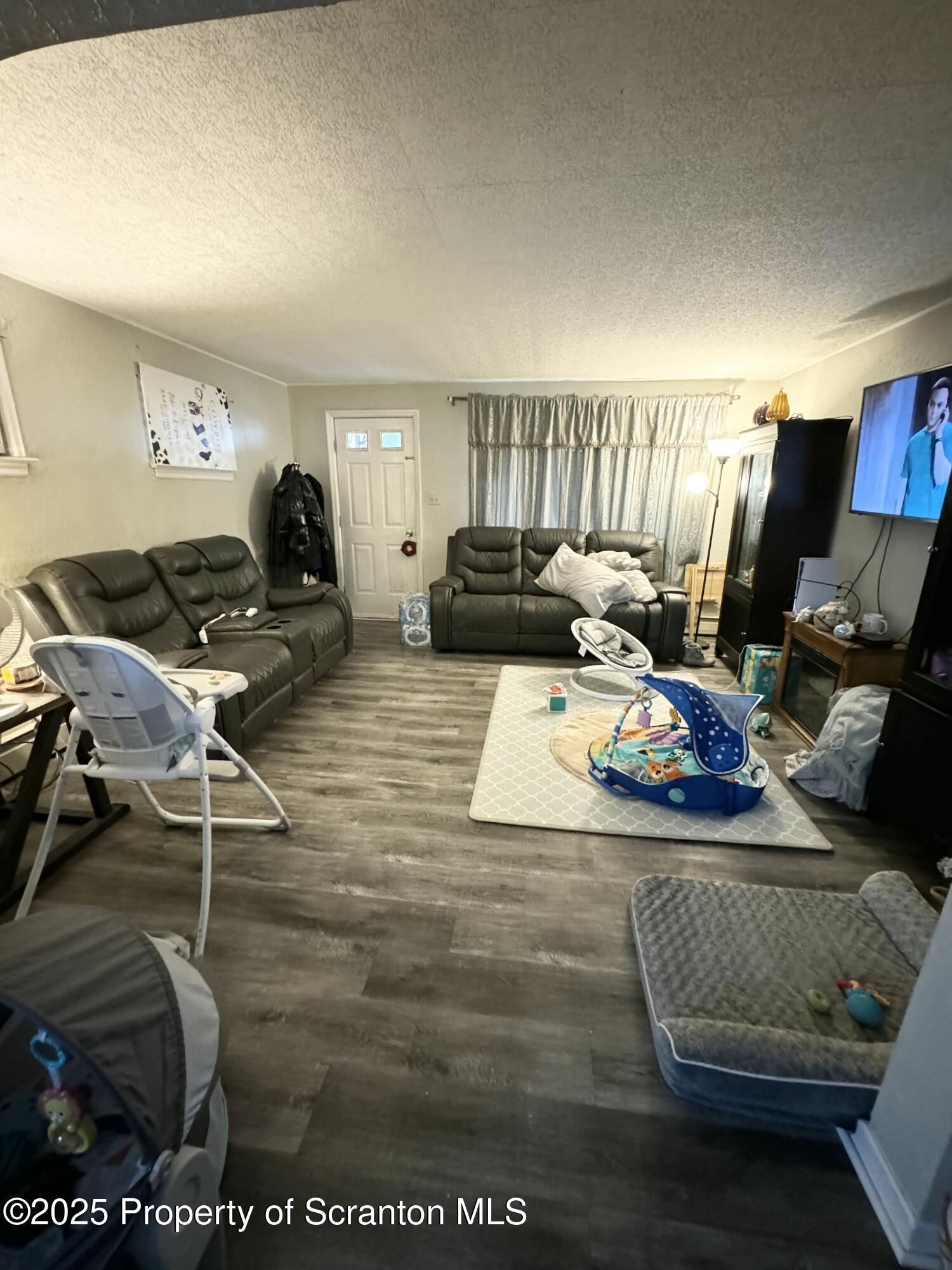 520 Charles Street Luzerne, PA 18709 - Photo 4 of 31 a view of living room filled with furniture and a couch