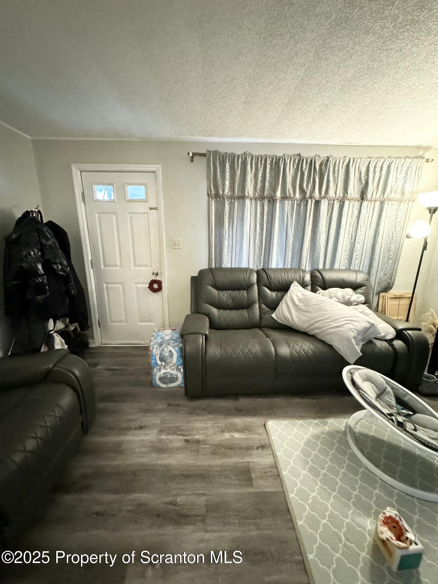 520 Charles Street Luzerne, PA 18709 - Photo 5 of 31 a living room with furniture and a couch