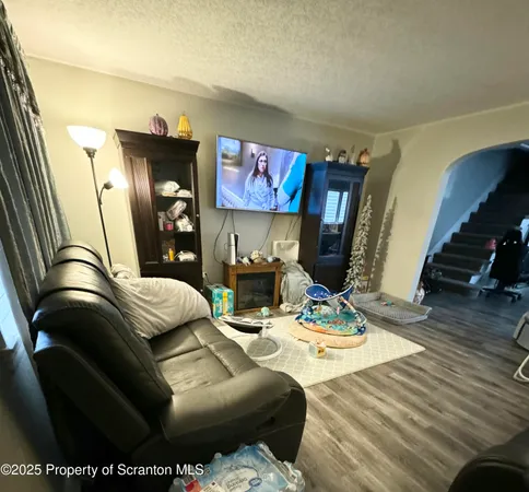 a bedroom with furniture and a lamp