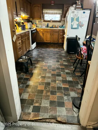 a kitchen with sink cabinets and window