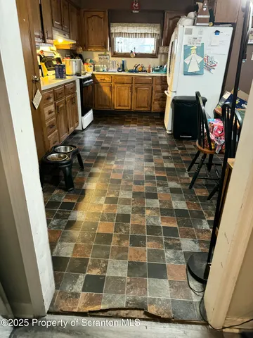a kitchen with sink cabinets and window