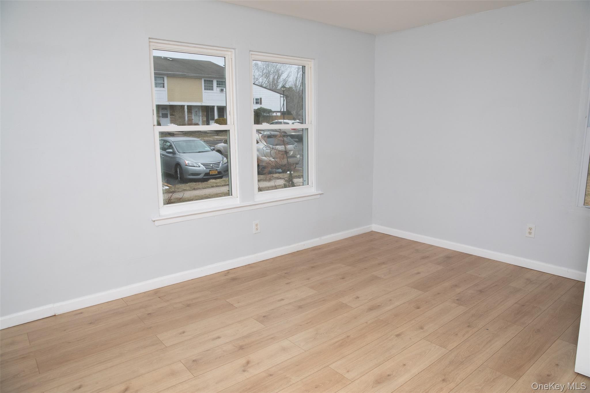 1 A Jamestown Court Ridge, NY 11961 - Photo 12 of 15 an empty room with a window