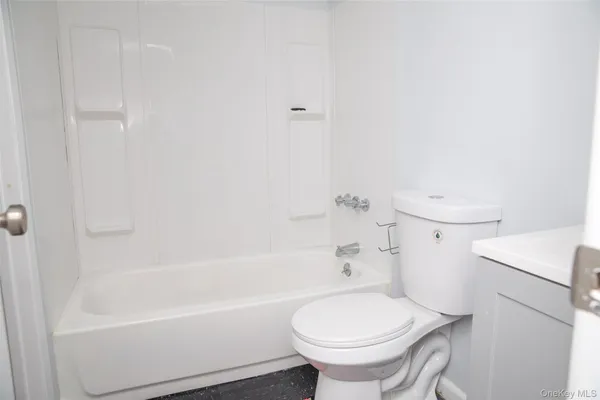a bathroom with a sink toilet and bathtub