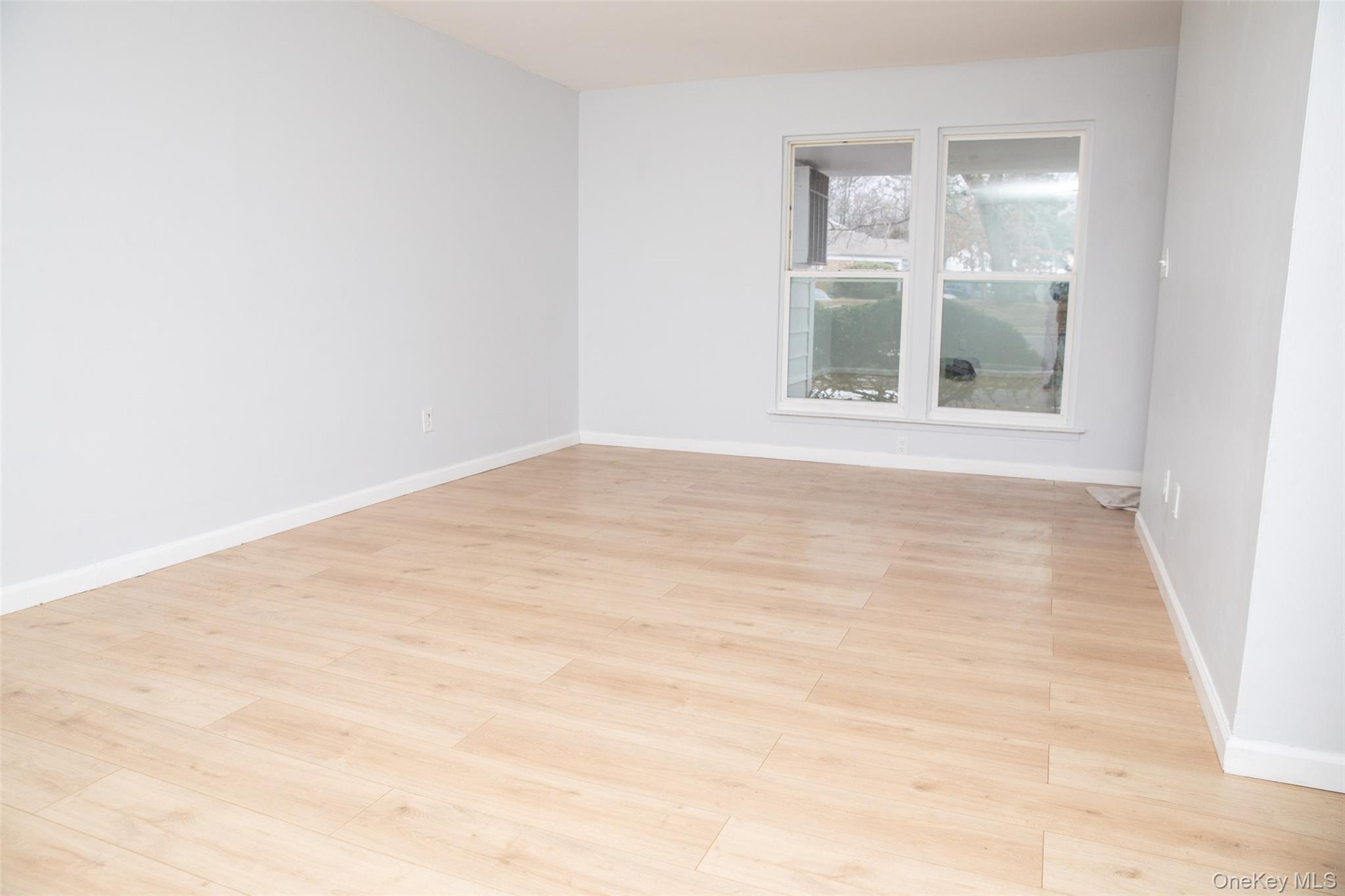 1 A Jamestown Court Ridge, NY 11961 - Photo 15 of 15 a view of an empty room with a window