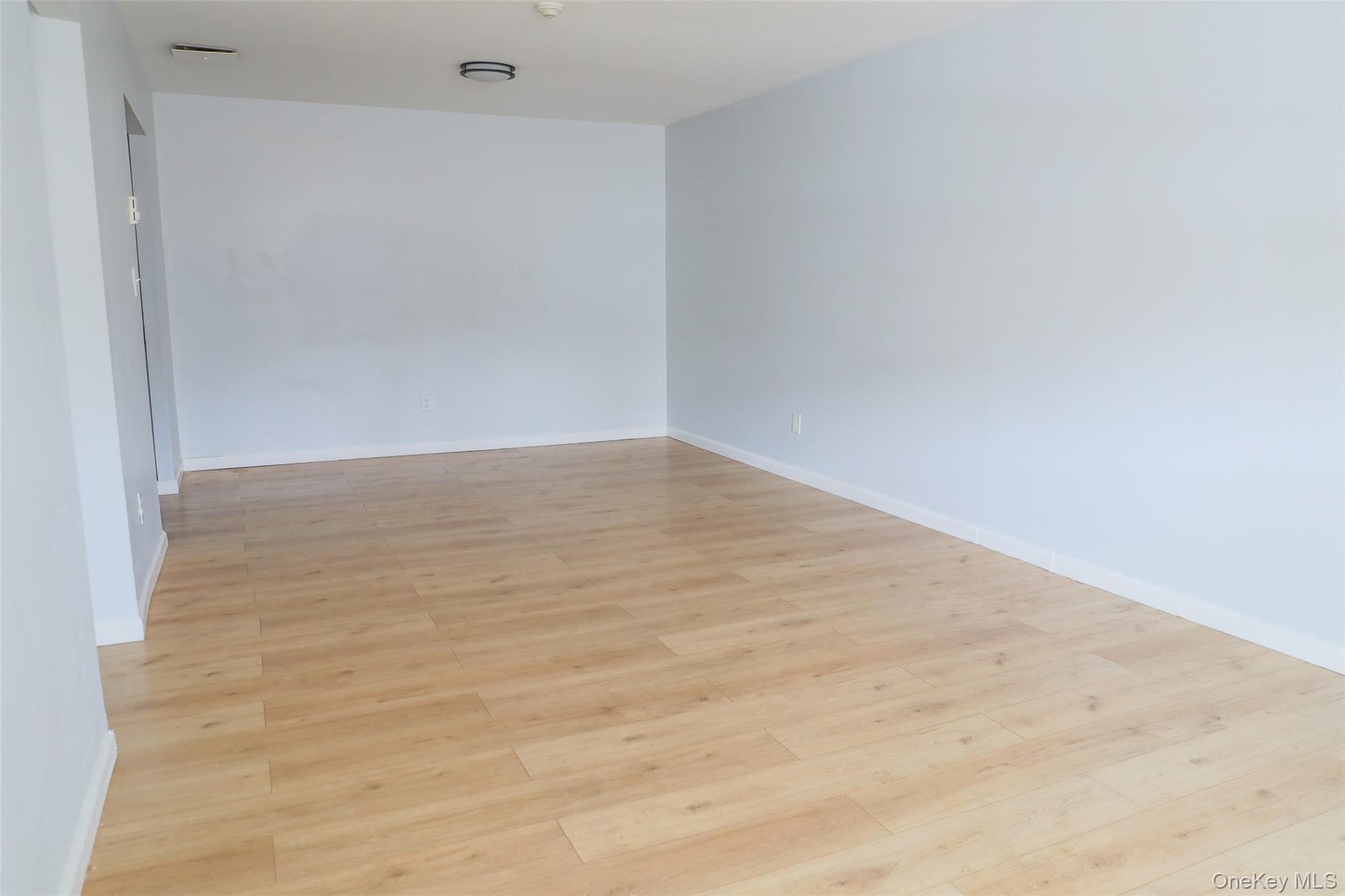 1 A Jamestown Court Ridge, NY 11961 - Photo 4 of 15 a view of an empty room