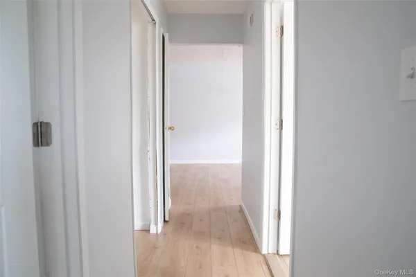 a view of a bathroom from a hallway