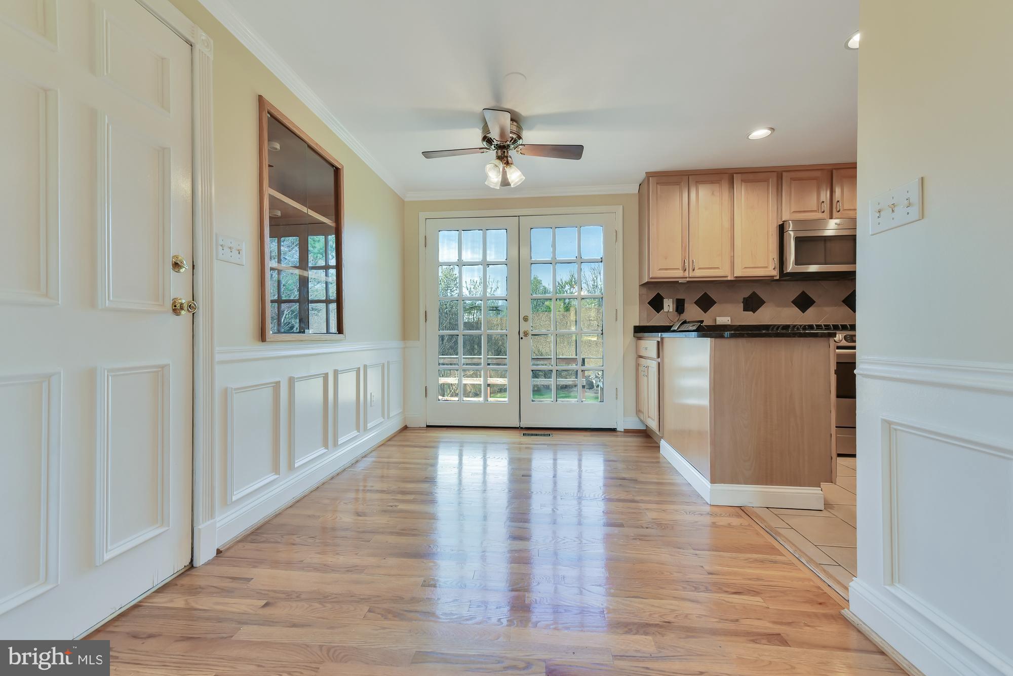 19052 Staleybridge Road Germantown, MD 20876 - Photo 20 of 49 Double doors lead to back deck from kitchen