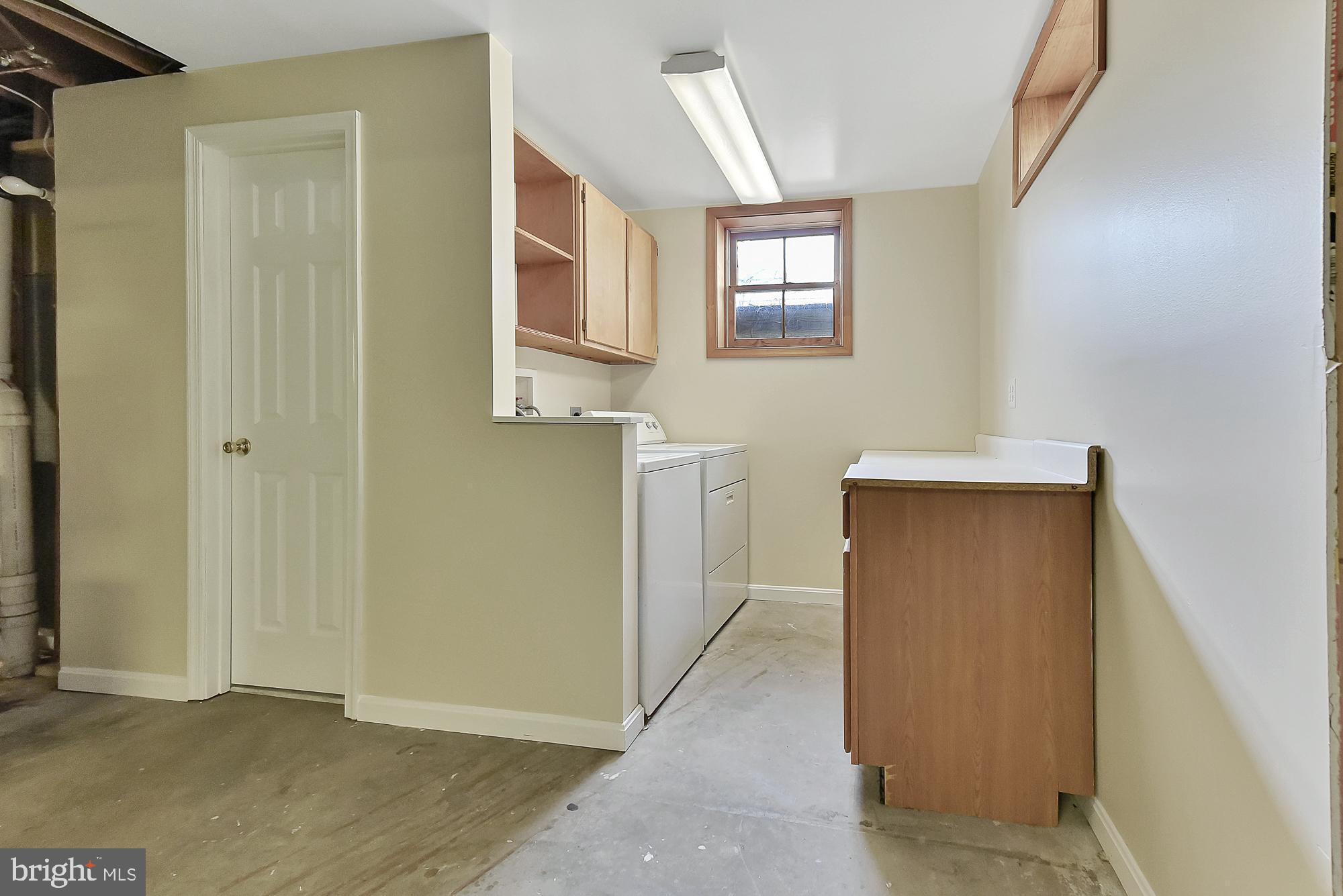 19052 Staleybridge Road Germantown, MD 20876 - Photo 40 of 49 Washer and dryer in basement