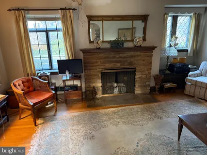 a view of a dining room with furniture and a window