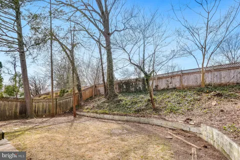 a view of a yard covered in snow