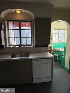 a kitchen with a sink and a cabinets