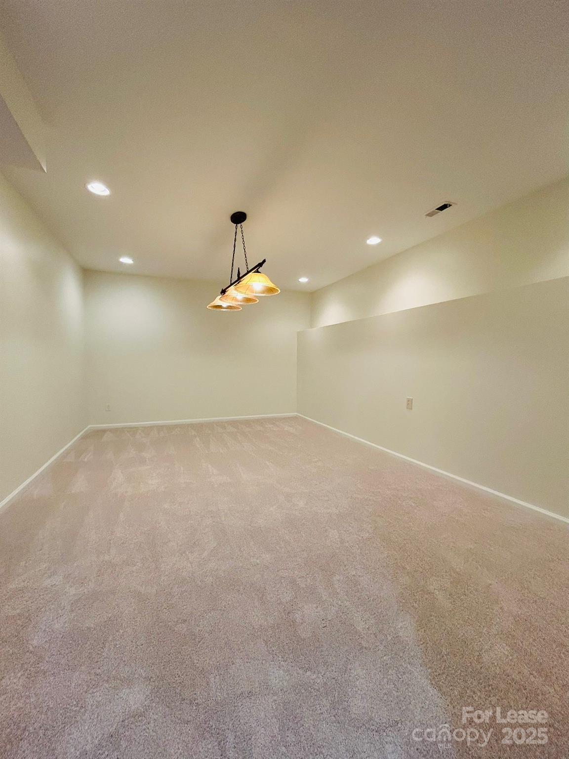 1916 Seefin Court Indian Trail, NC 28079 - Photo 5 of 8 an empty room with a ceiling fan and window