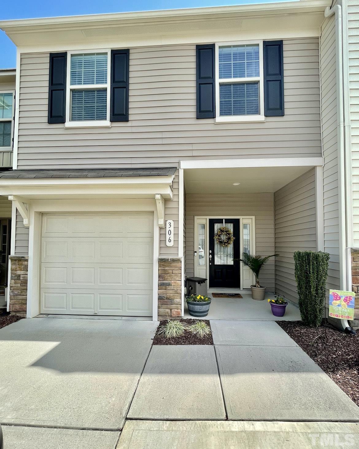 306 Leighann Ridge Lane Rolesville, NC 27571 - Photo 1 of 13 a front view of a house with a yard