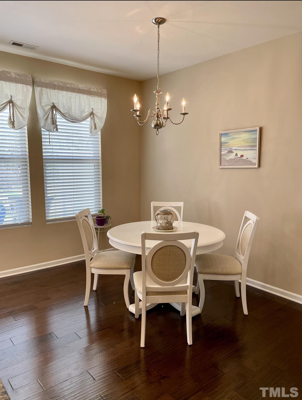 306 Leighann Ridge Lane Rolesville, NC 27571 - Photo 6 of 13 a view of a dining room with furniture wooden floor and chandelier