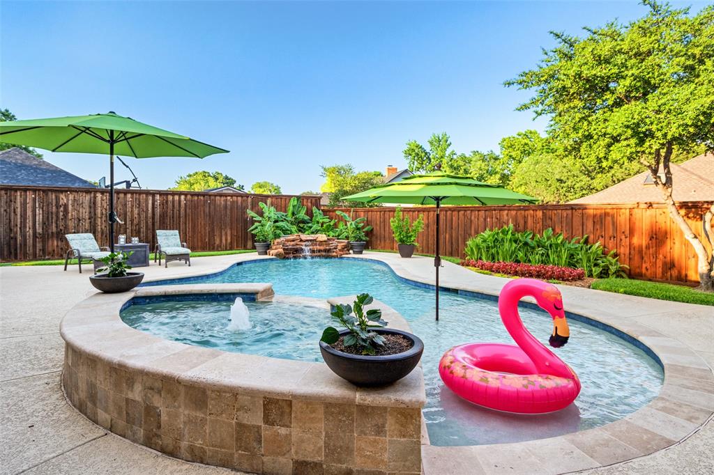 400 Hunters Ridge Circle Coppell, TX 75019 - Photo 27 of 35 a view of a wooden chairs and table in the patio