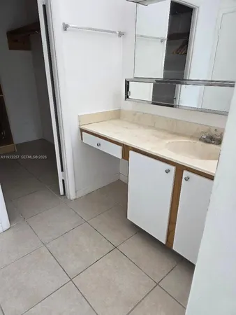 a view of storage and utility room with a sink