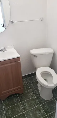 a bathroom with a toilet and a sink