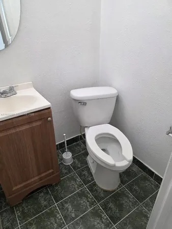 a bathroom with a toilet and a sink