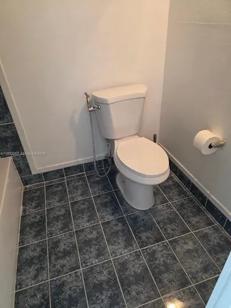 a bathroom with a toilet