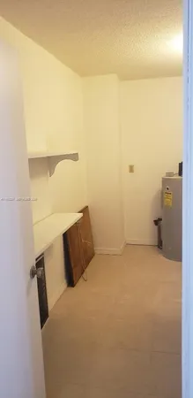 a bedroom with a bed and cabinets