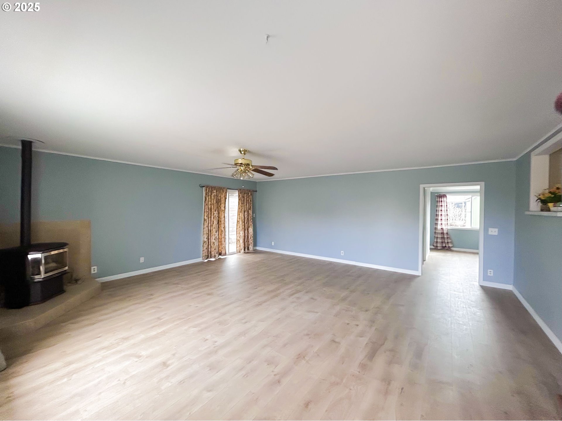 1925 Myrtle Street Baker City, OR 97814 - Photo 12 of 31 a view of empty room with wooden floor and fan