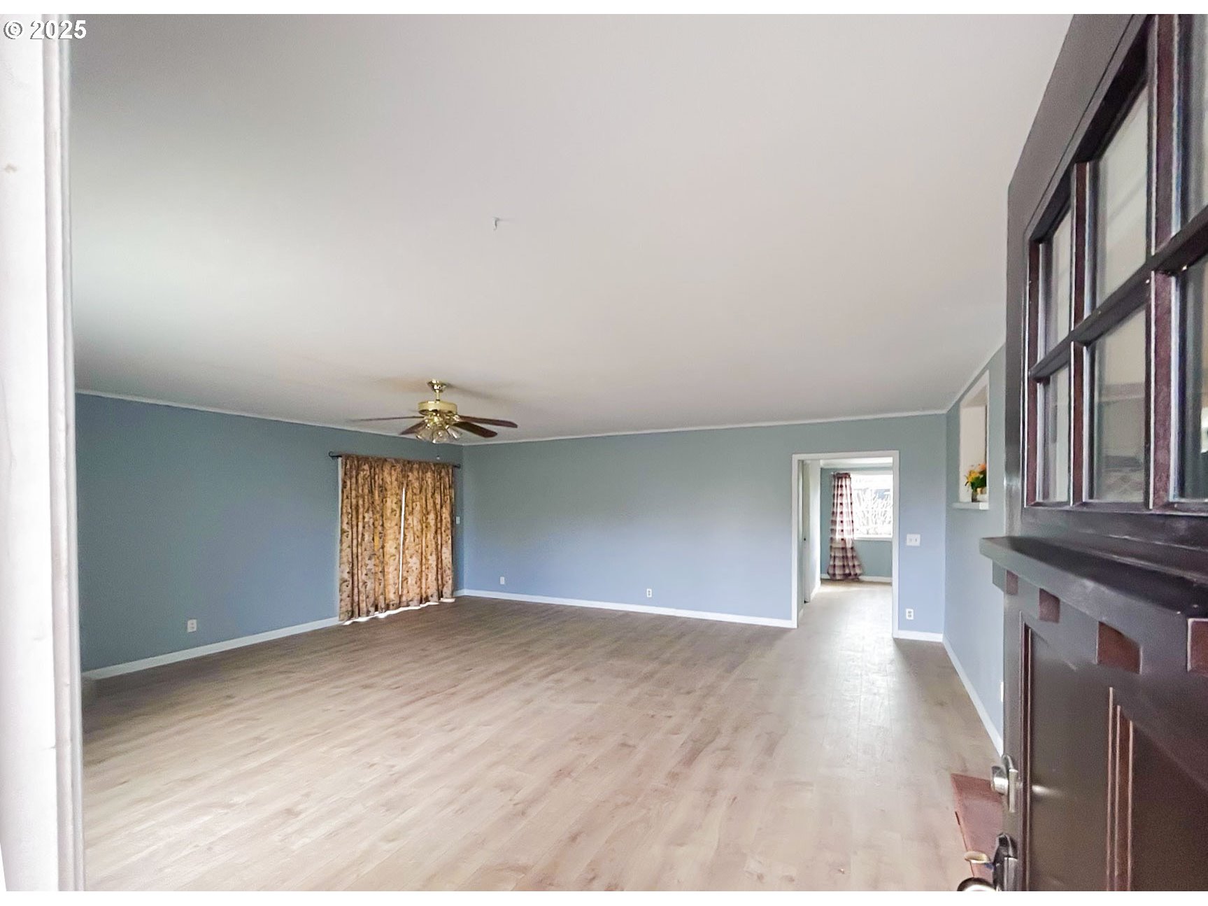 1925 Myrtle Street Baker City, OR 97814 - Photo 14 of 31 a view of an empty room with window and wooden floor