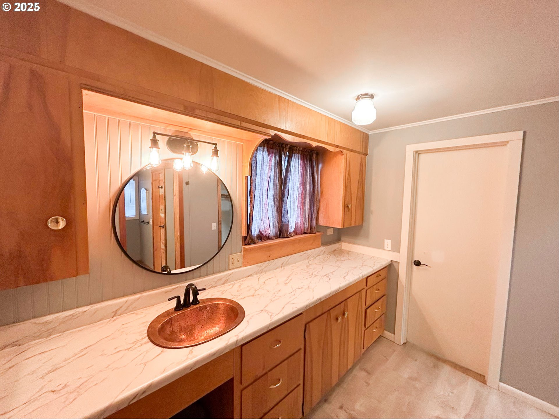 1925 Myrtle Street Baker City, OR 97814 - Photo 21 of 31 a bathroom with a granite countertop sink and a mirror