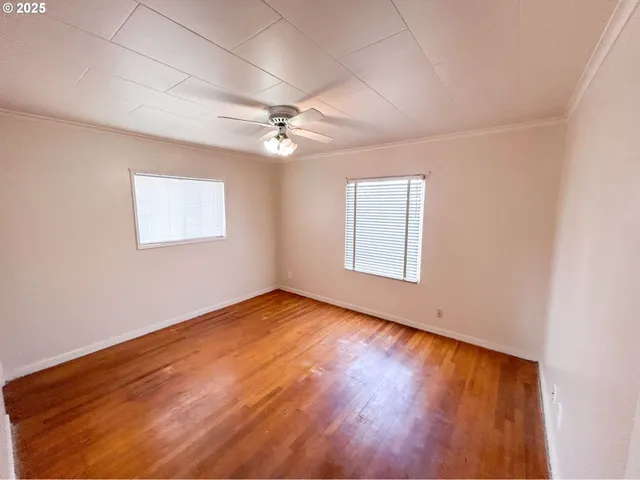 a kitchen with granite countertop kitchen island stainless steel appliances a sink appliances and wooden floor