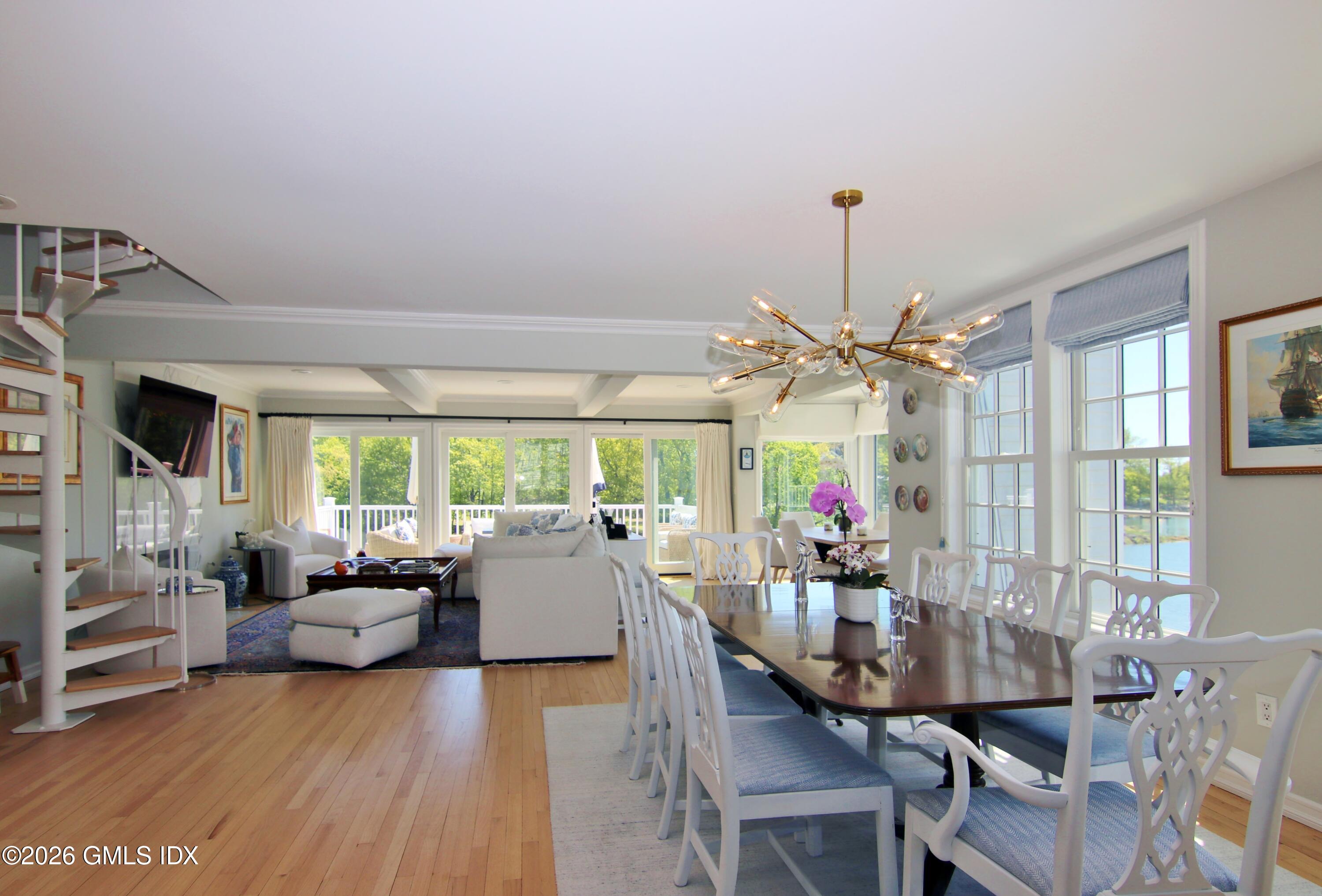 633 Steamboat Road, Unit 5 Greenwich, CT 06830 - Photo 23 of 29 a view of a dining room with furniture window and wooden floor