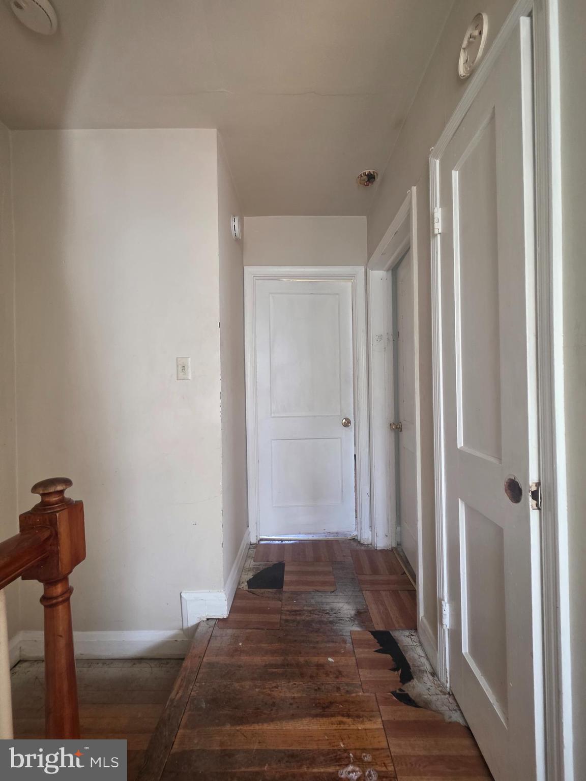5933 Leith Walk Baltimore, MD 21239 - Photo 11 of 28 a bedroom with a bed and wooden floor