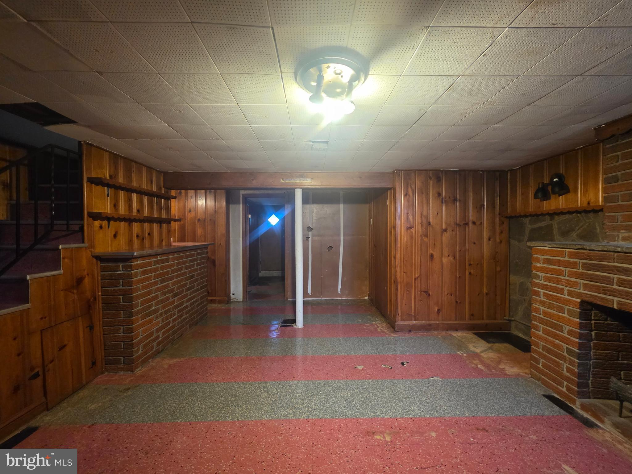 5933 Leith Walk Baltimore, MD 21239 - Photo 25 of 28 a view of hallway with stairs and a wooden floor