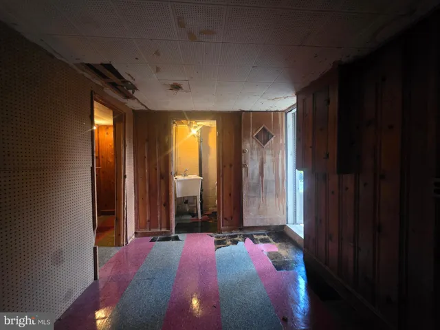 a spacious bedroom with a bed and a window