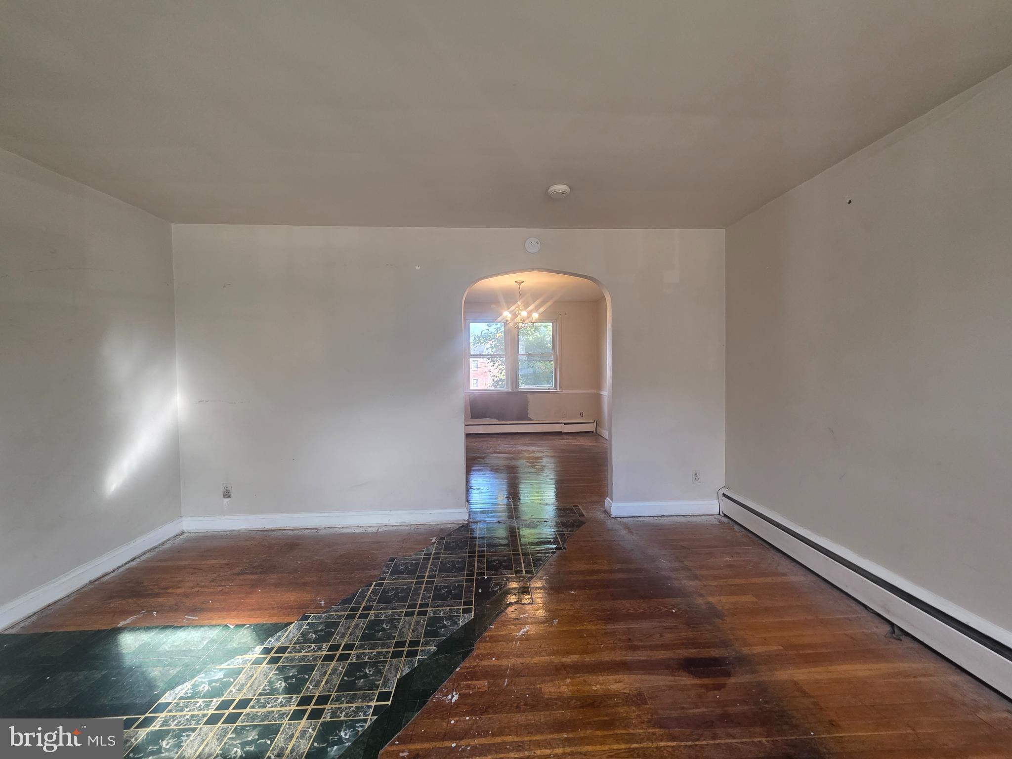 5933 Leith Walk Baltimore, MD 21239 - Photo 3 of 28 a view of a room with wooden floor and stairs