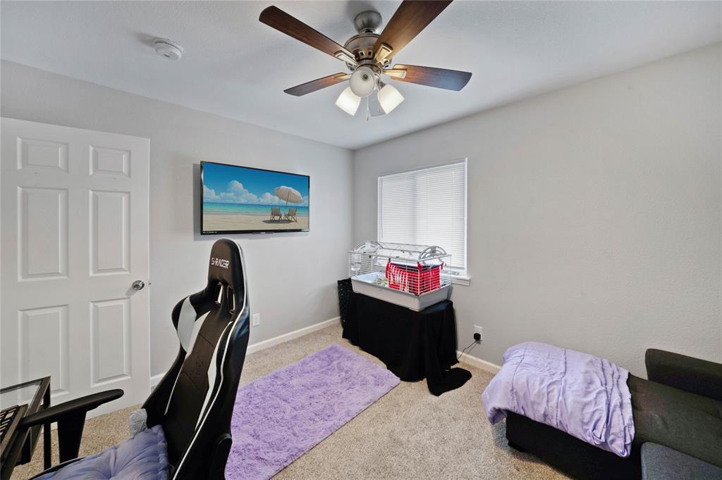 1301 Thoreau Lane Allen, TX 75002 - Photo 20 of 31 a bedroom with furniture and a chandelier