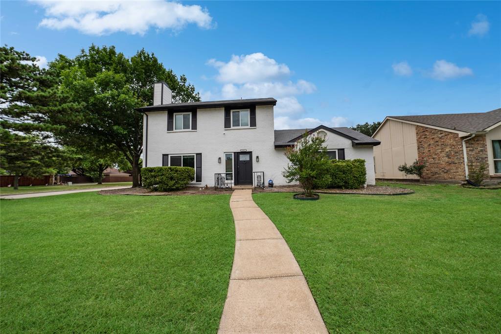 1301 Thoreau Lane Allen, TX 75002 - Photo 2 of 31 a front view of house with yard and green space