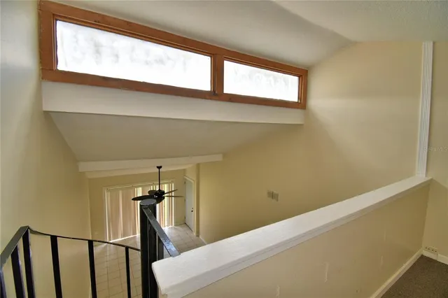 a view of a hallway with a window