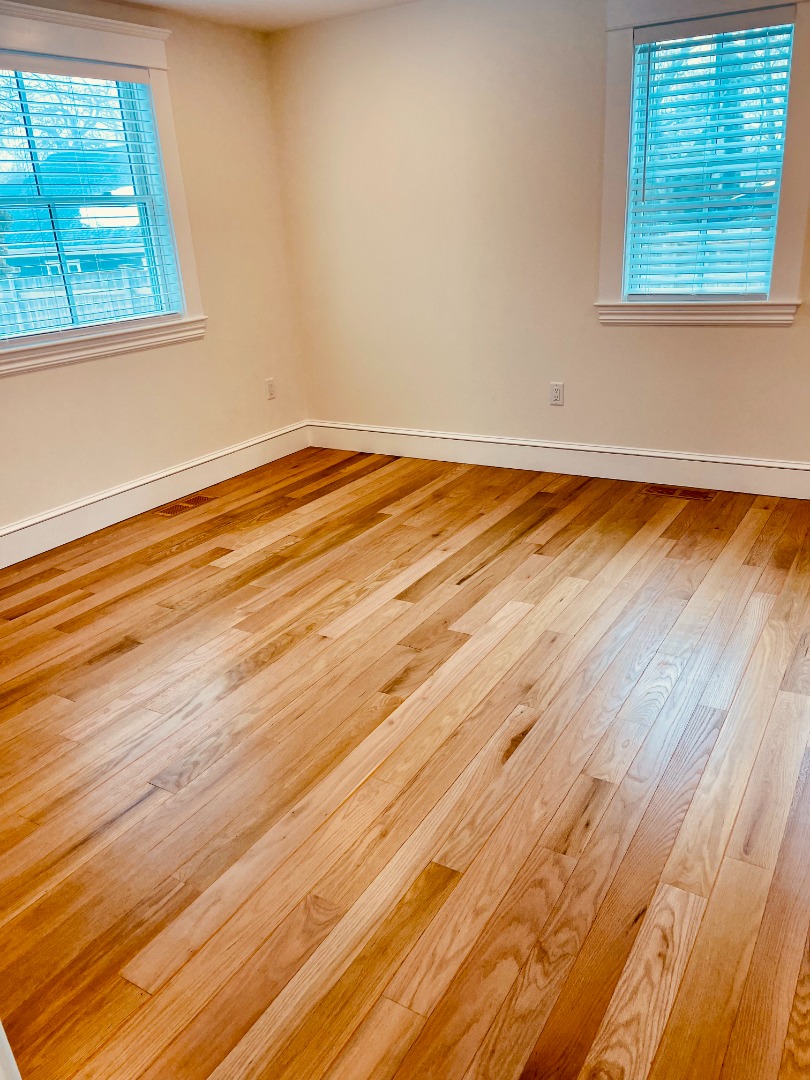 23 Pinehurst Road Edgartown, MA 02539 - Photo 55 of 57 an empty room with wooden floor and windows