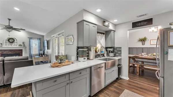 a kitchen with a sink stove and cabinets