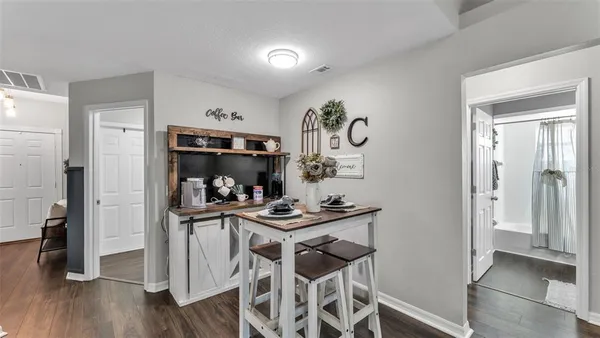 a kitchen with stainless steel appliances a wooden cabinets and stove top oven