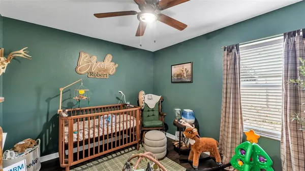a bedroom with furniture and a window