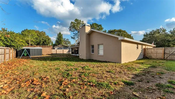 a house view with a backyard space