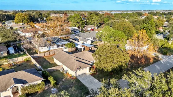 an aerial view of a house with a ocean view
