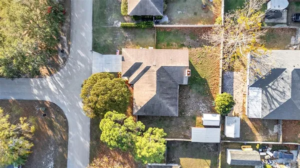 an aerial view of residential houses with outdoor space