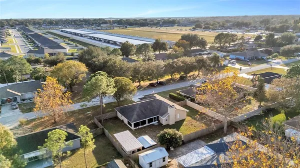 an aerial view of residential building and lake