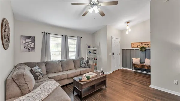 a living room with furniture and a large window